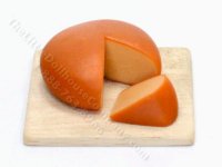 Miniature Wheel of Gouda on a Board by Charlotte Willmott (image for) Miniature Wheel of Gouda on a Board by Charlotte Willmott